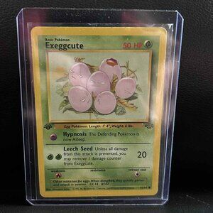 Exeggcute - 52/64 - Common - 1st Edition  Jungle Pokemon Trading Card